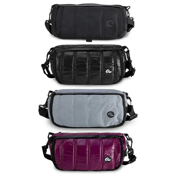 Four Skunk Uptown Crossbody Duffle Bags—black, shiny black, gray, and shiny purple—each 100% smell & weather proof with carbon lining, front pocket, zipper, and adjustable strap, displayed vertically on a white background.